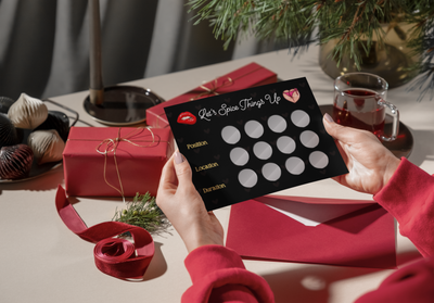 Girlfriend giving her boyfriend a romantic gift featuring intimate scratch cards for a sexy night in