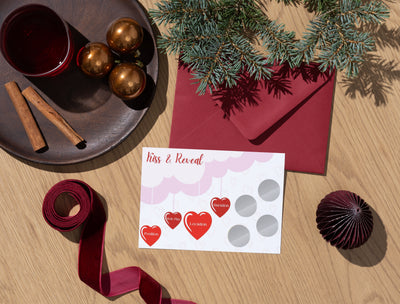 Product display of the Kiss & Reveal intimacy scratch card, crafted for LGBTQ+ couples seeking fun and flirty moments.
