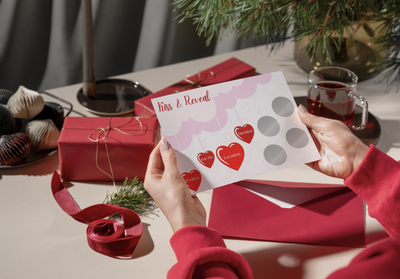 Kiss & Reveal scratch card in gift-ready packaging – perfect for lesbian, gay, or queer couples looking for romantic fun.