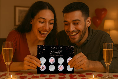A gay couple scratching off a sensual challenge from Naughty Trouble during a romantic date night at home.